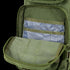 An opened Condor Compact Assault Backpack 24L in Scorpion OCP reveals an inner pocket holding several blue plastic card sleeves.